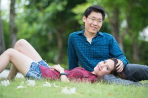 Engaged couple in park.